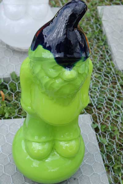 Garden gnome in glass, one of several in a variety of colors